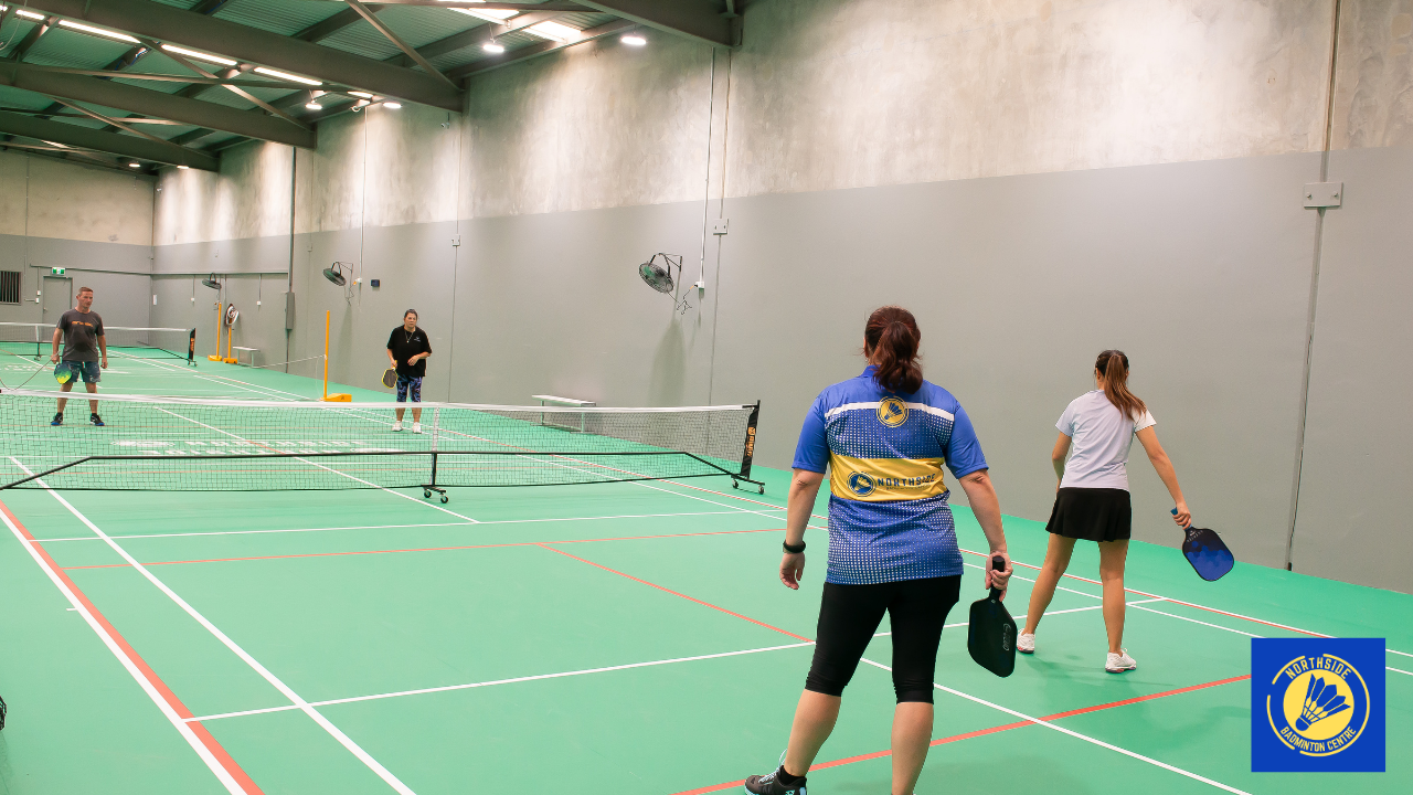 Players enjoying an indoor pickleball game at Northside Badminton Centre in Brendale, featuring modern courts for social play, casual games, and all skill levels.